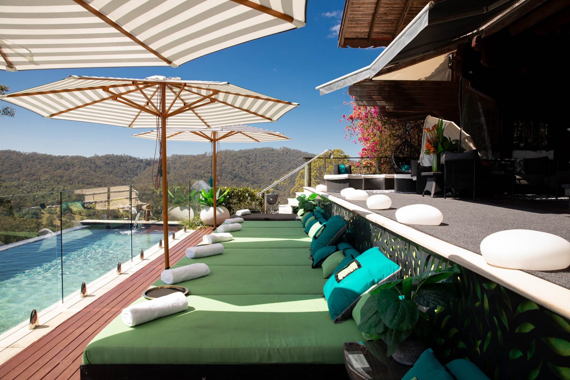 Loungers and striped umbrellas beside the pool