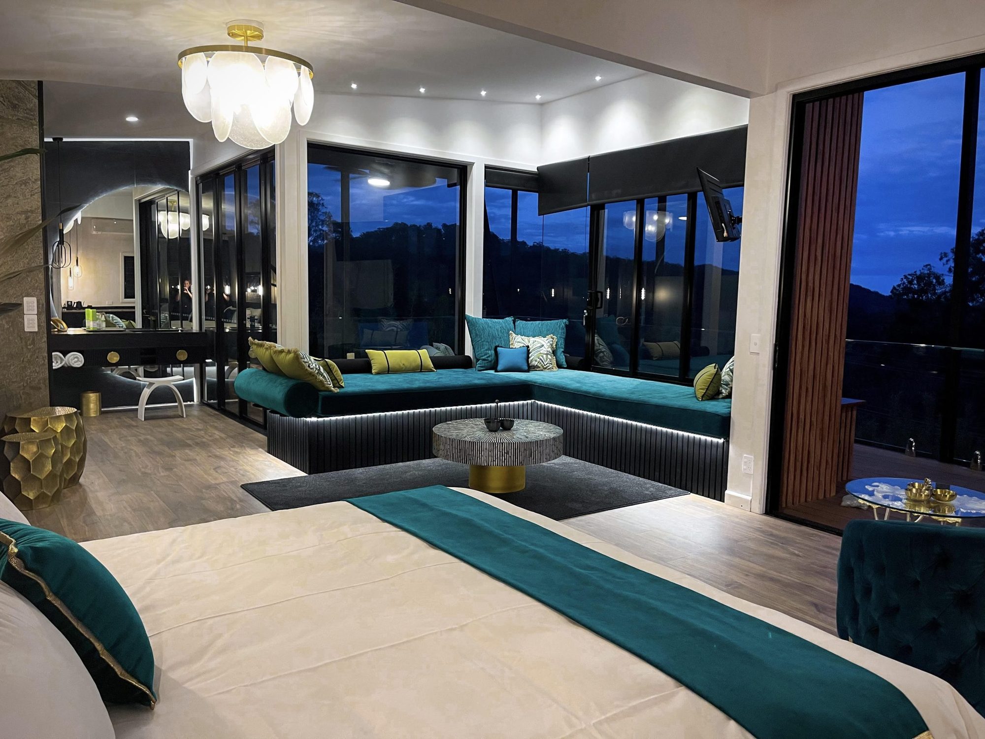 Villa living area with lounge, chandelier and valley views