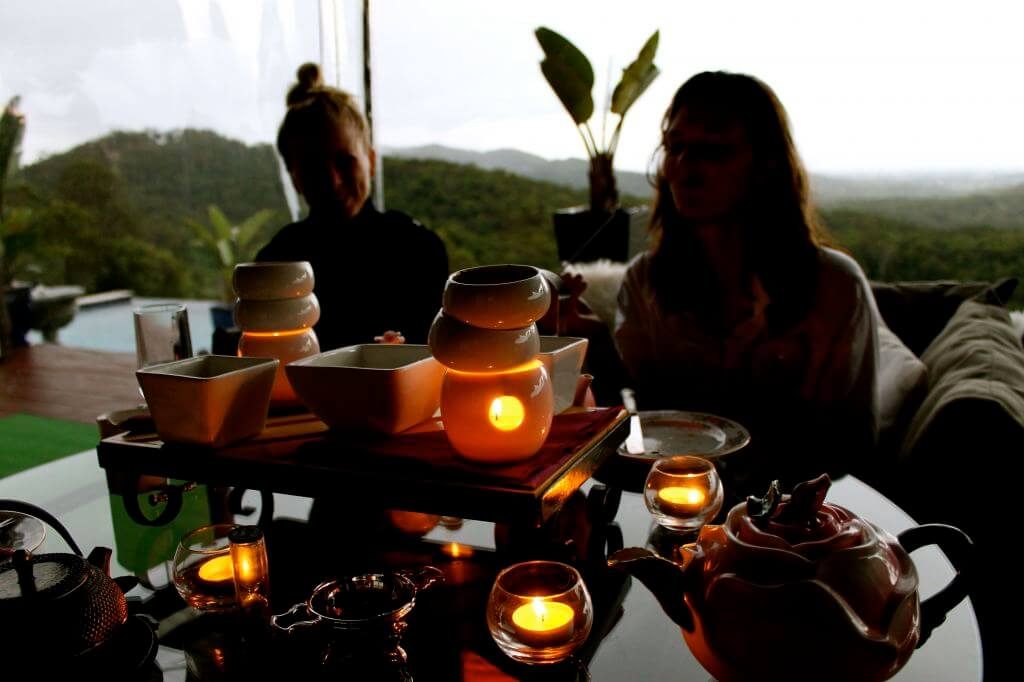 Guests enjoying tea at dusk on the terrace