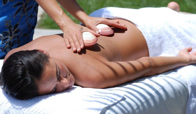 Hot stone massage on a guest's back