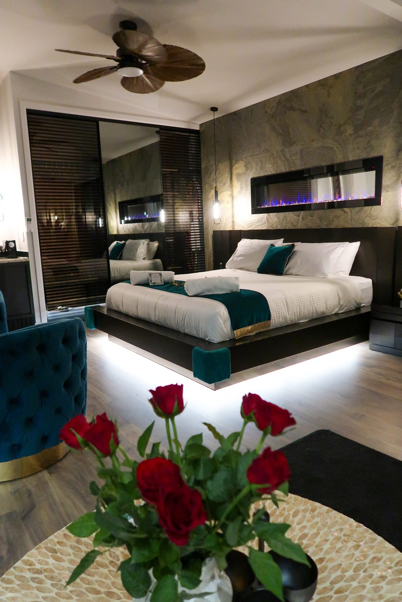 Villa bedroom with red roses on the table