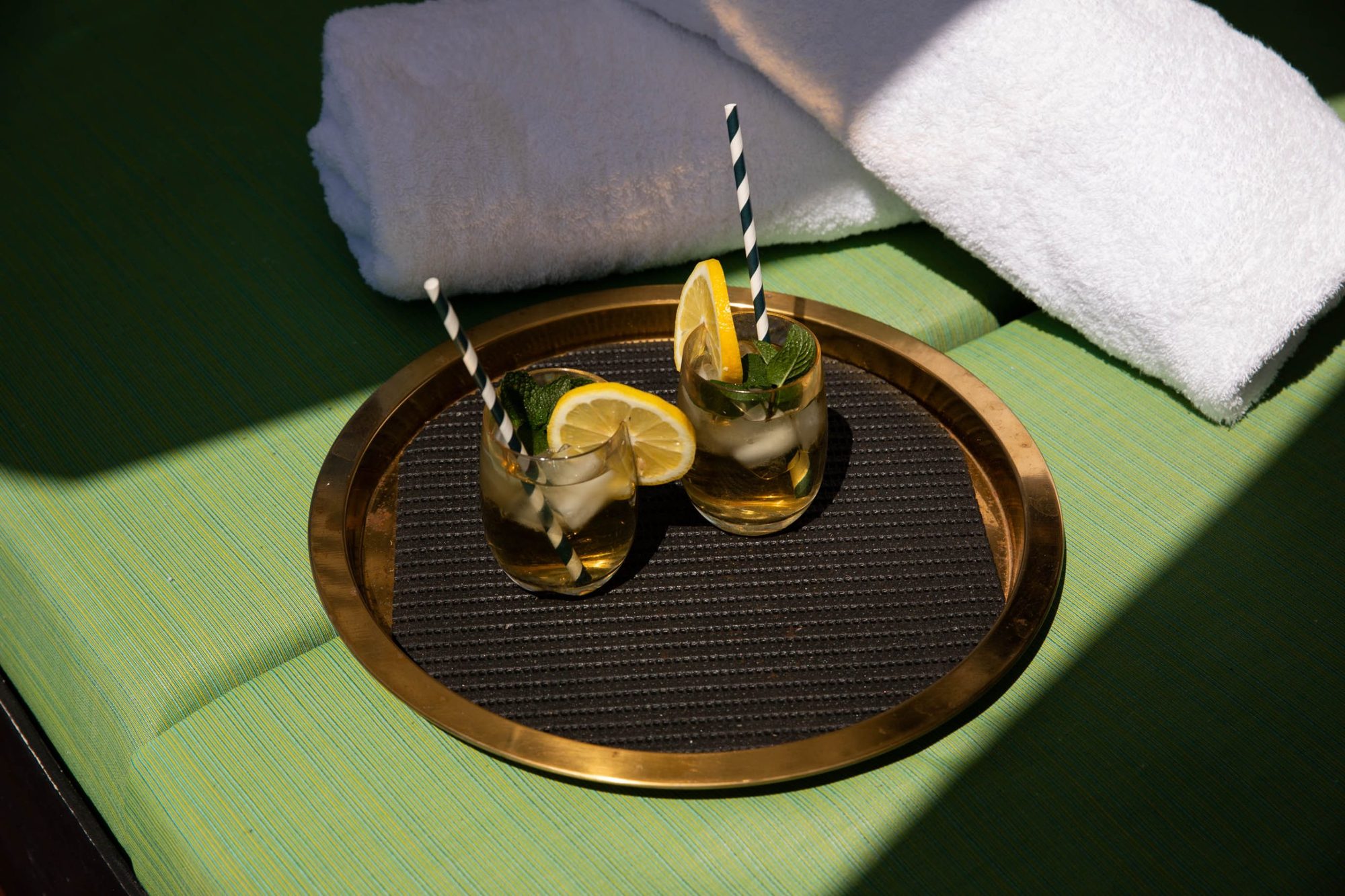Tray of iced lemon drinks on a lounge